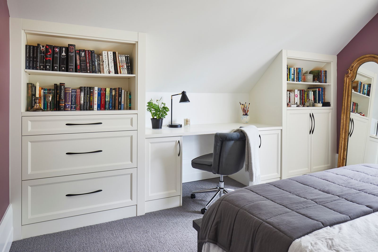 Bedroom with office and bookshelves on either side in Markham home renovation