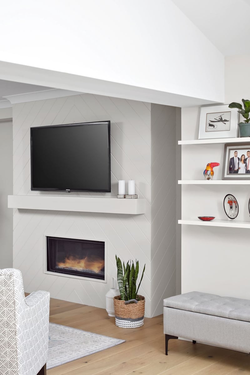 Built-in fireplace with floating tv above in modern Markham home renovation