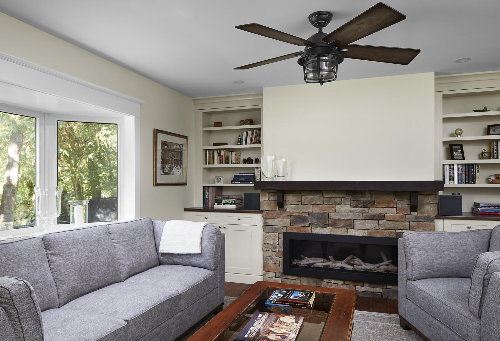 Custom family room with stacked stone fireplace and brick surrounding in Markham Ontario
