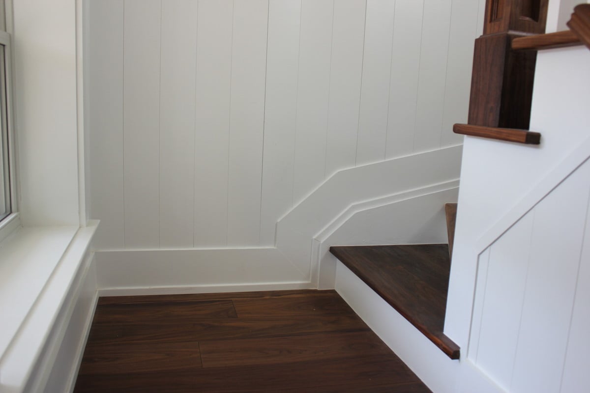 Custom trim on staircase with beadboard on side in Markham, Ontario home