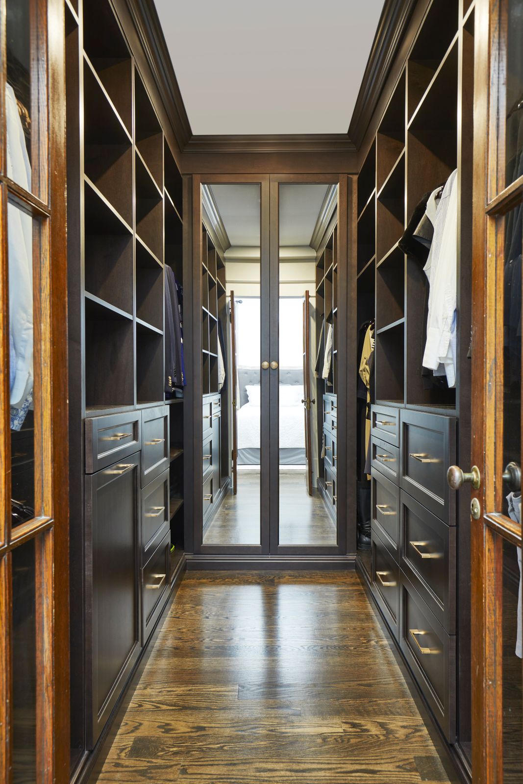 Custom walk-in closet in bedroom renovation in Toronto