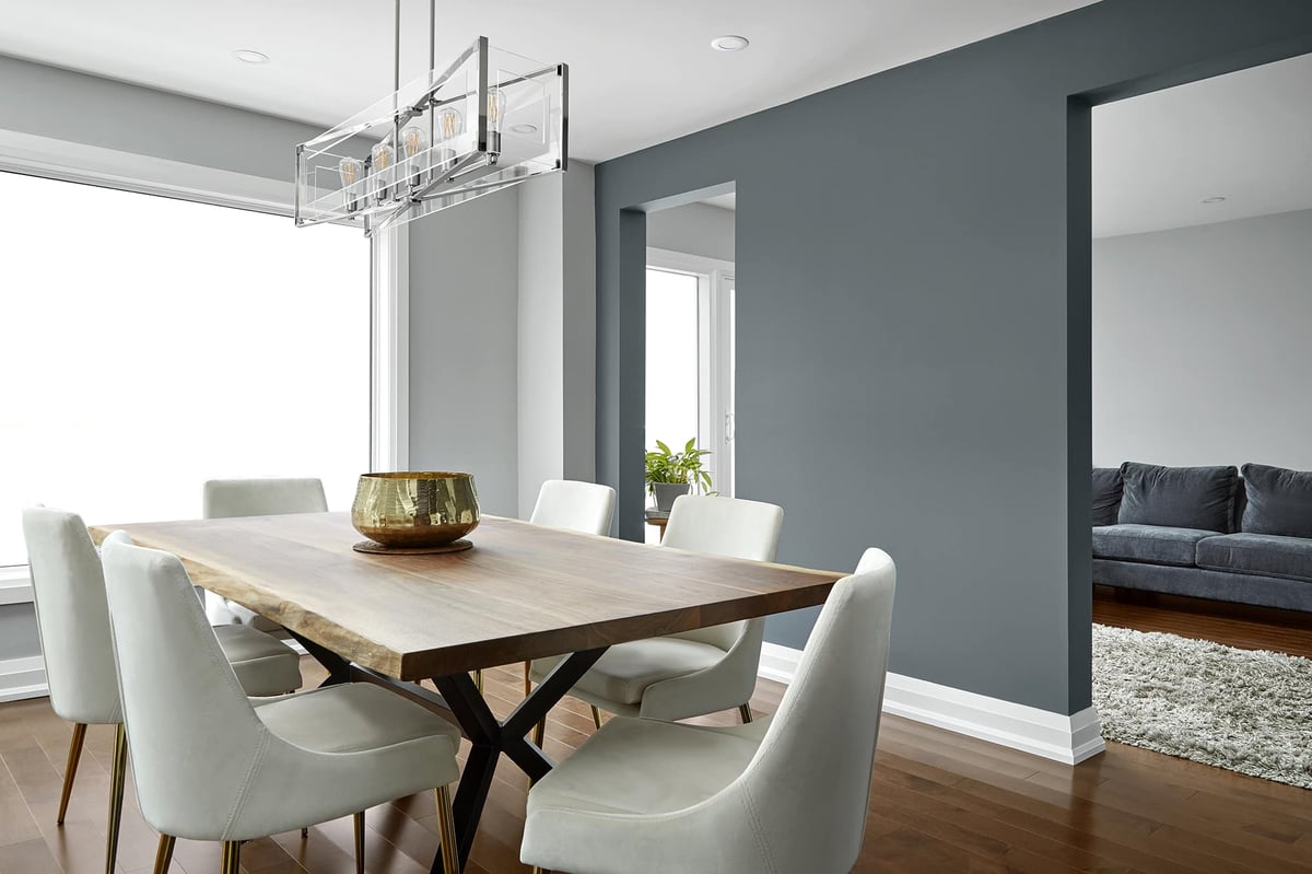 Dining room renovation with pendant lighting and six chairs in Markham home renovation