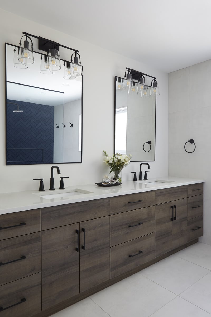 Double vanity in primary ensuite renovation with matte black fixtures