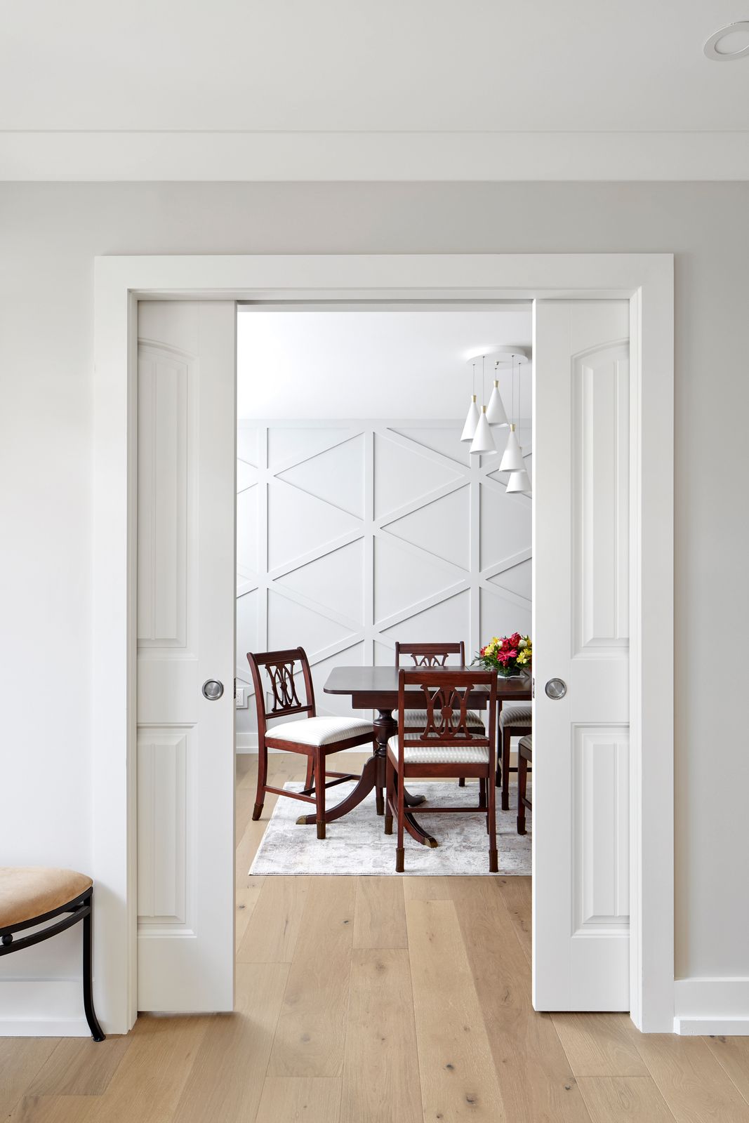 Dual pocket doors looking into living room in Markham luxury home renovation
