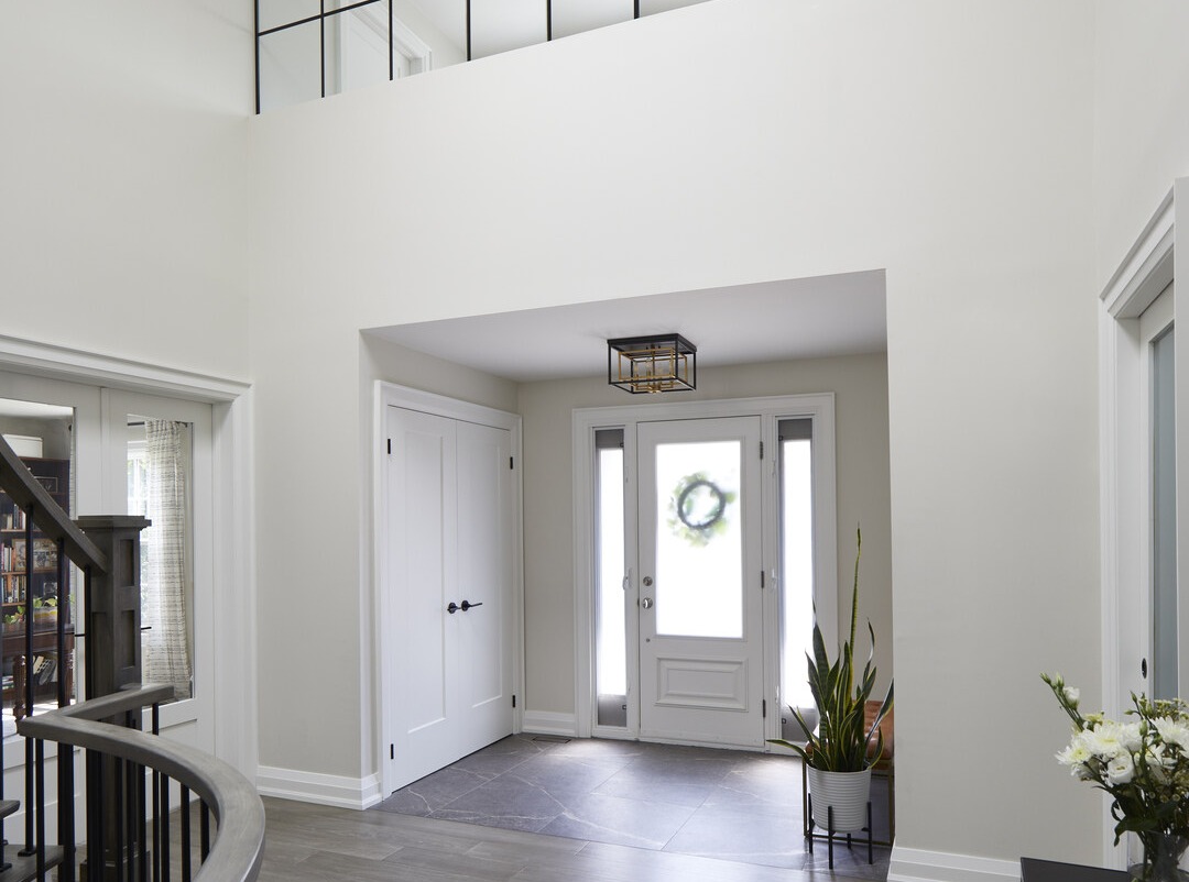 Entryway in Markham home renovation with office above by Master Edge Homes