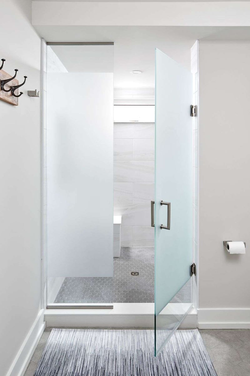 Frosted glass door to walk-in shower in Markham luxury bathroom renovation