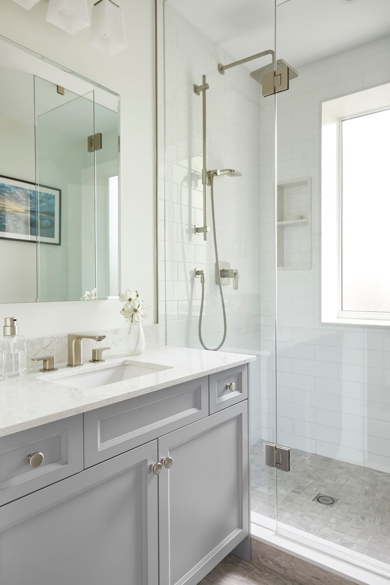 Gray bathroom vanity with brass pulls in Markham, Ontario