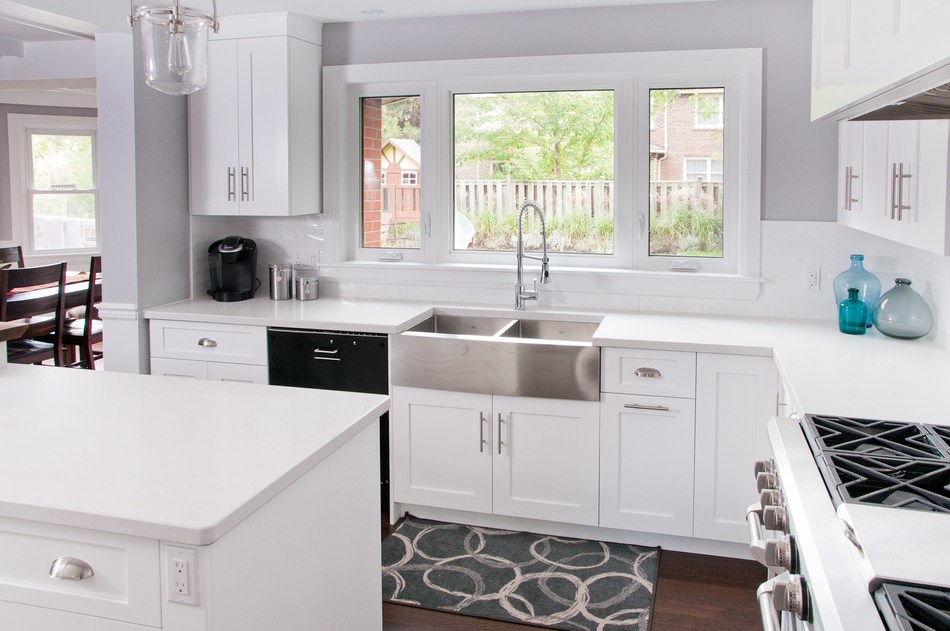 White kitchen with island and double stainless steel sink