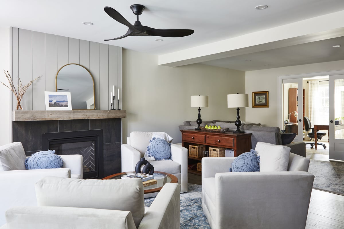 Living room renovation in Markham with modern three-blade black ceiling fan in front of fireplace