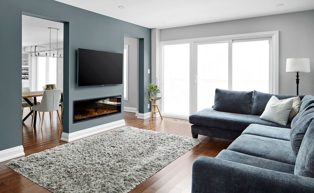 Markham home renovation living room with tv on wall and fireplace