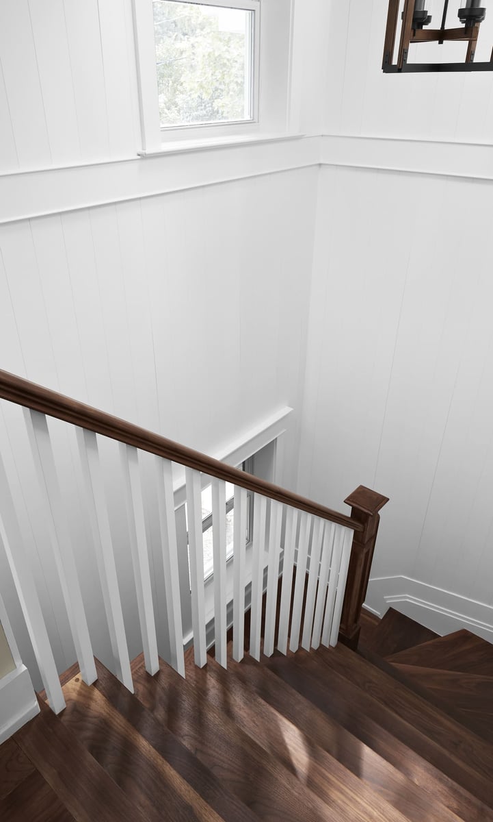 Staircase details in Markham renovation with white rail posts