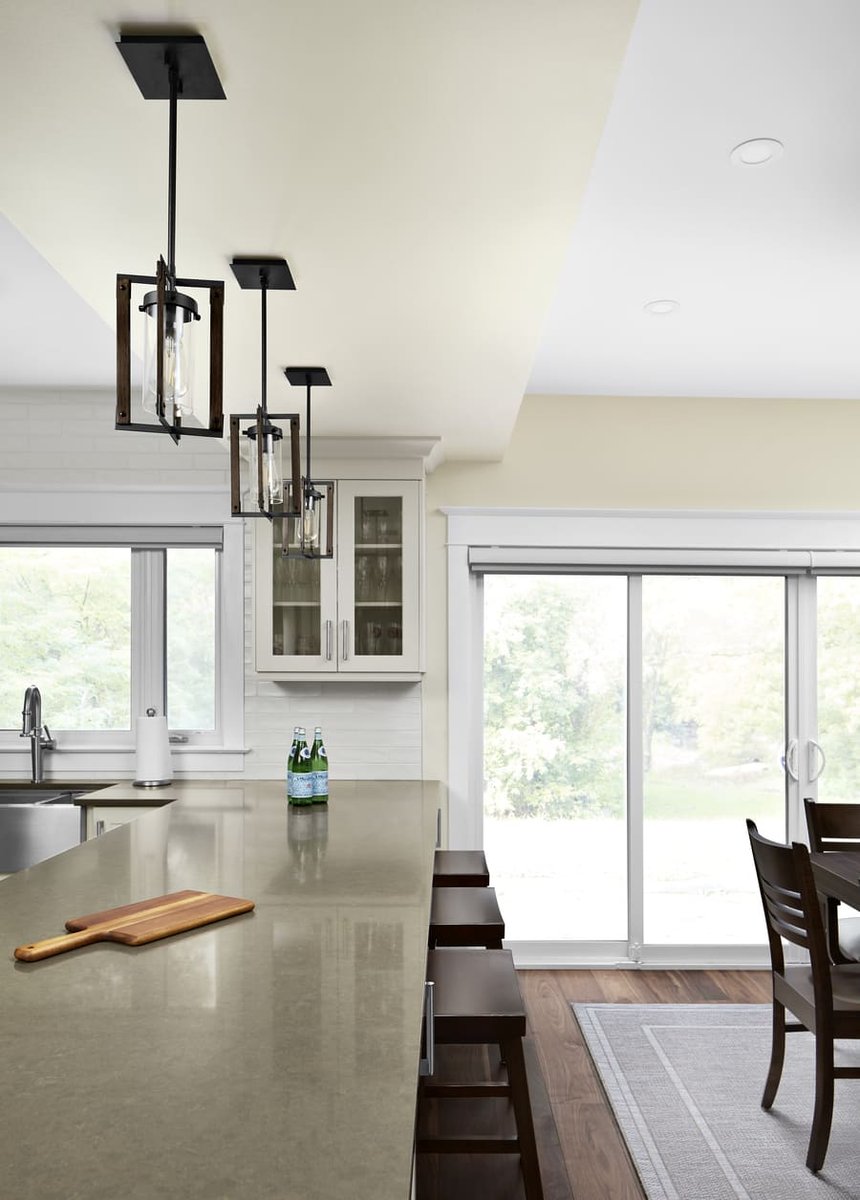 View of kitchen island in Markham with sliding glass doors showing view of river