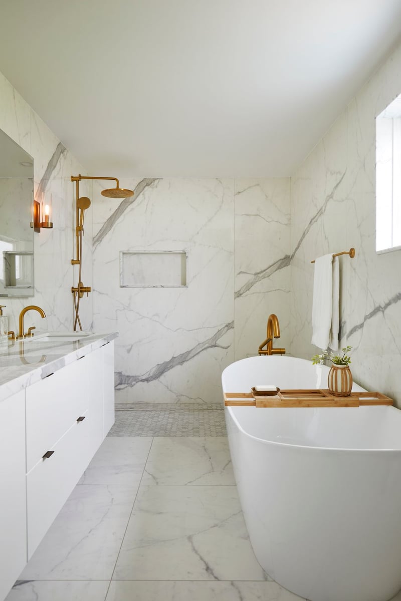 Elegant marble bathroom renovation with brass faucets and all marble bathroom in Markham, Ontario